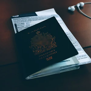 Passport resting on travel documents